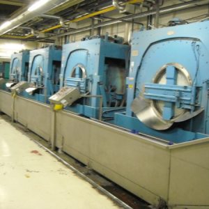 Four Milnor 300kgs Open-pocket washer extractors